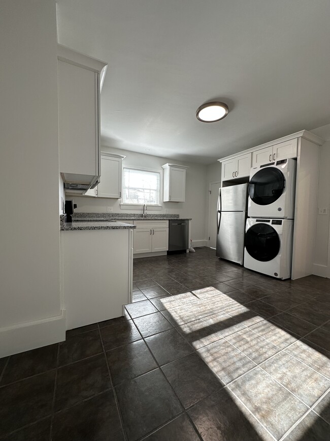 Spacious kitchen with all brand new amenities featuring in unit, washer and dryer - 12 Tiffany St