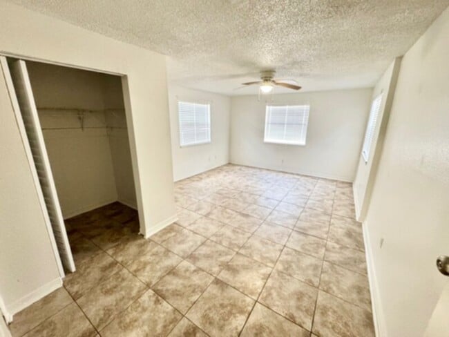 Building Photo - 4 Bedroom, 2 Bath House with Huge Fenced Yard, ALL Tile Floors!