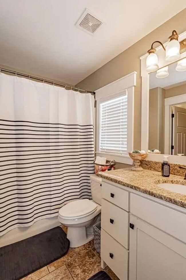 Building Photo - LOCATION, LOCATION, LOCATION - 4 Bedroom 3 Bath Home with TONS of storage. THIS PRICE INCLUDES TH...