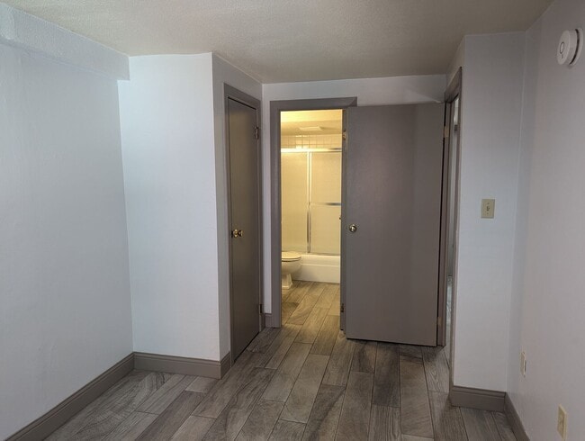 Building Photo - High Rise Living Directly Across the Street from Campus!