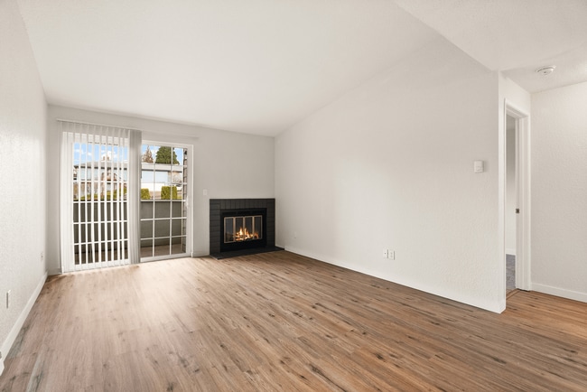 Experience cozy comfort in this elegant living room, perfect for relaxation and entertaining. - Monte Vista Apartments