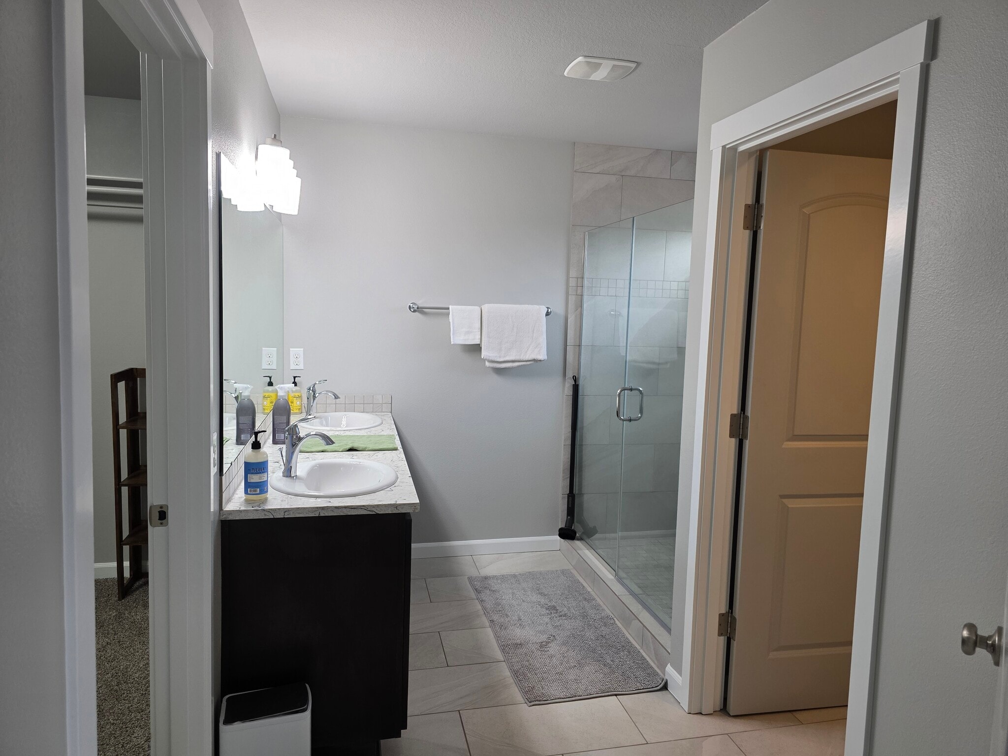 Private bathroom sinks and glass shower - 10721 NE 109th St