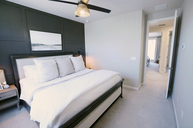 Master bedroom with designer wall and ceiling fan. Easily fits a king size bed (king bed pictured). - 15637 E Broncos Pl