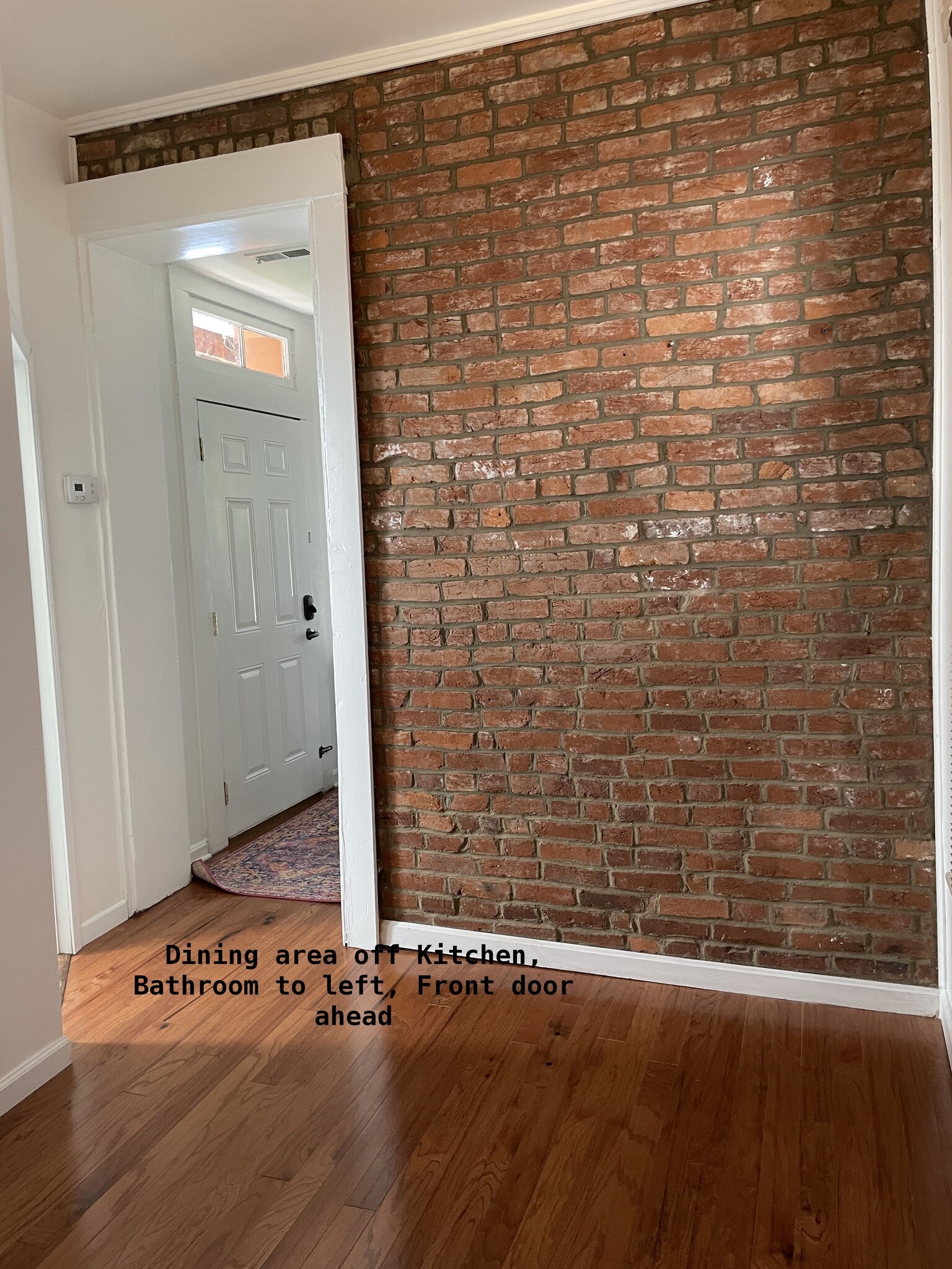Dining area has exposed brick - 810 E Washington St