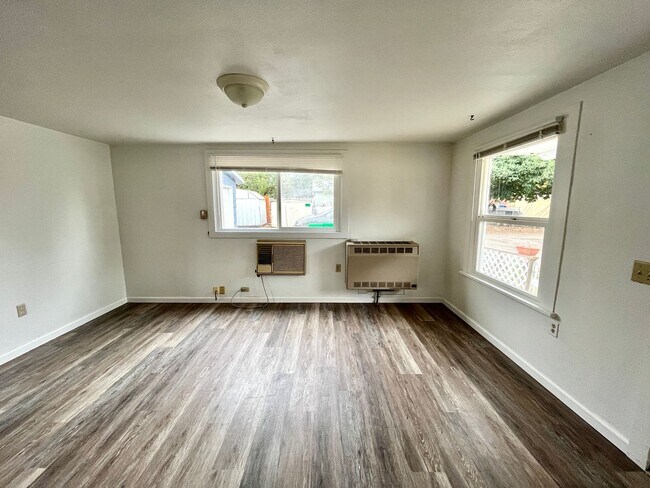 Building Photo - Cozy Single family home with two car garage and controlled access gate