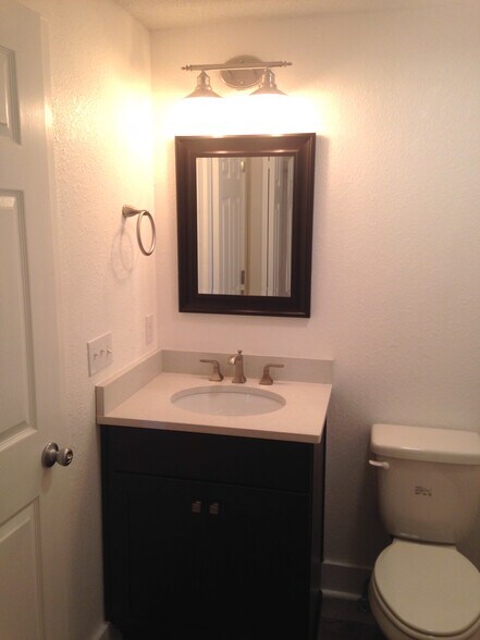 Half bath has enclosed washer/dryer closet - 1533 Yancey Street
