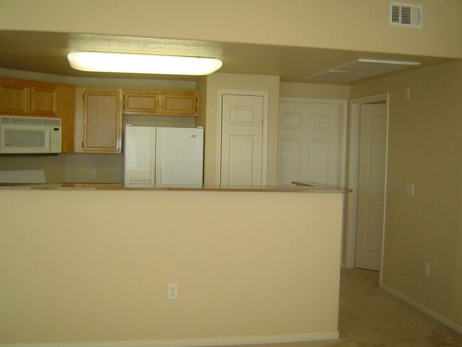 Building Photo - Move-In Ready Condo with Private Balcony & Modern Upgrades