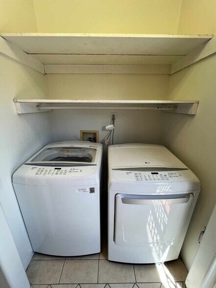 Washer and dryer service area with additional storage. - 2330 S Mansfield Ave