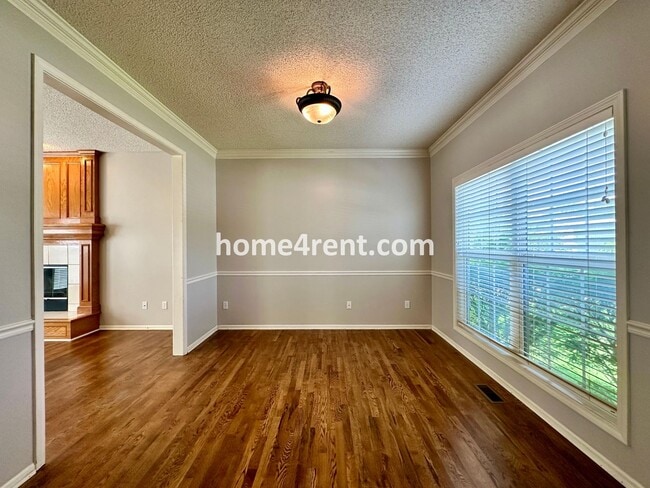 Building Photo - Beautiful Four-Bedroom Home with Three Car Garage, Wood Floors, Finished Basement and a Fenced Ya...