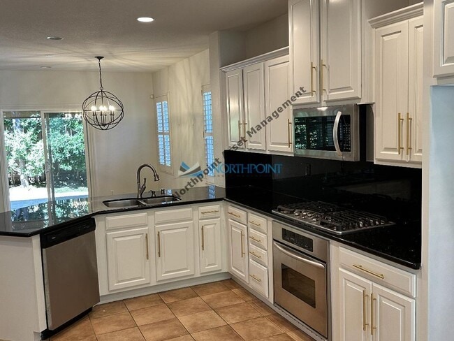 Building Photo - 4BR/3BA w/ Solar + Downstairs Bed/Bath in Whitney Oaks