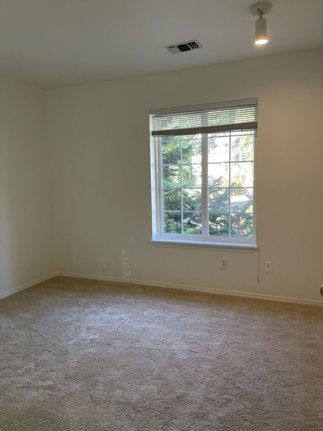 Building Photo - Bright, Spacious, Updated Condo with Separ...