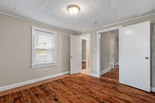 Building Photo - Adorable Home, Just Painted, Wood Flooring...