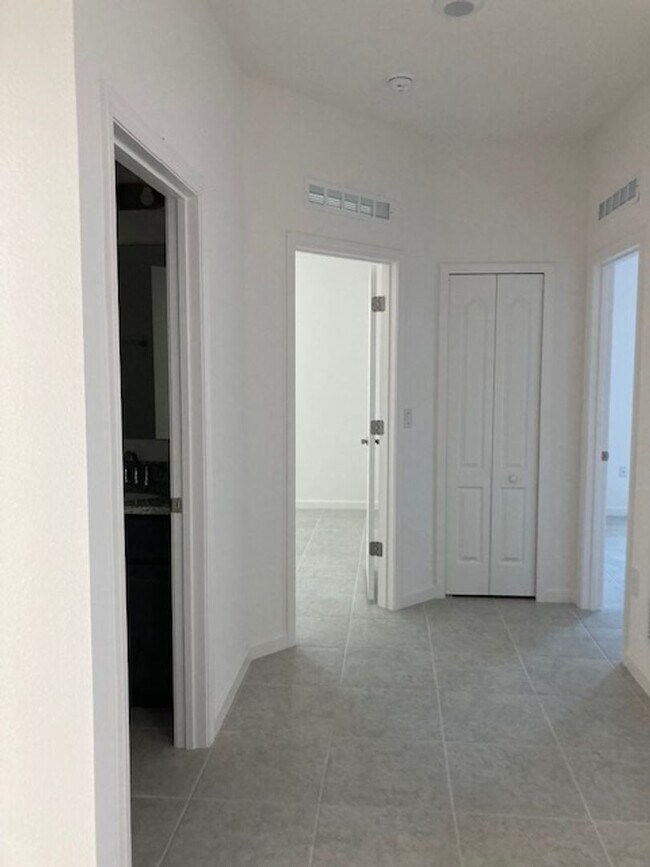 Building Photo - Like New 3 bedroom + den with French doors, screened in porch and Fenced yard and much more...
