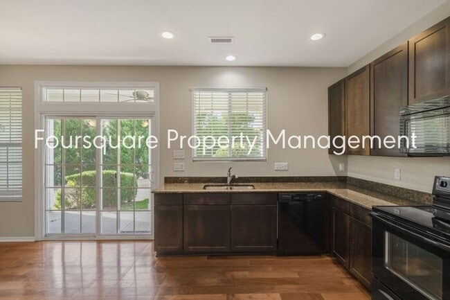 Building Photo - Charming Townhome with Open Layout, Back Patio & One-Car Garage – Near RTP, RDU & Everyday Conven...