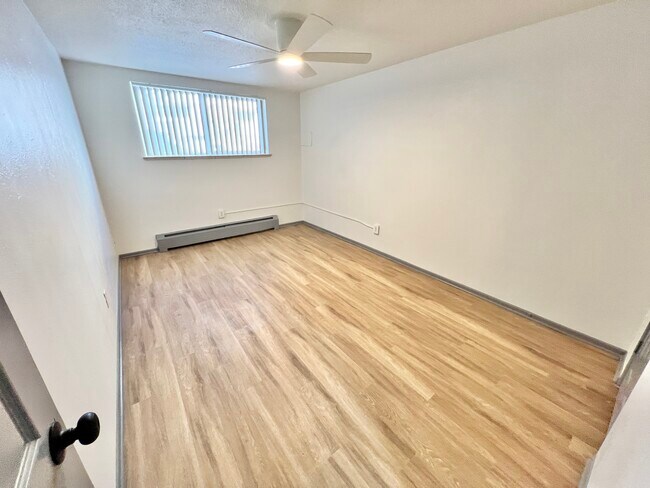 Experience the charm of this bright and airy bedroom, designed for modern living. - Melody Apartments