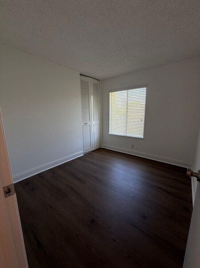 Building Photo - Recently updated home with new floors, paint & bathroom!
