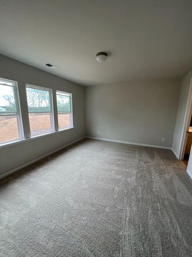 Building Photo - Townhome with 3BR/2.5BA Garage Located in ...