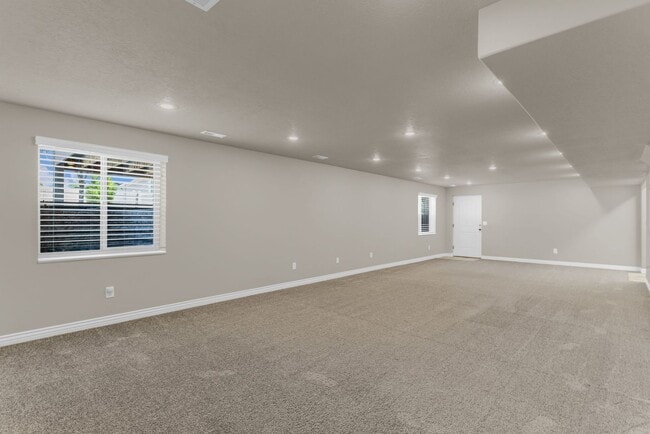 Building Photo - Spacious Syracuse Home with Covered Deck, Loft & Oversized 3-Car Garage