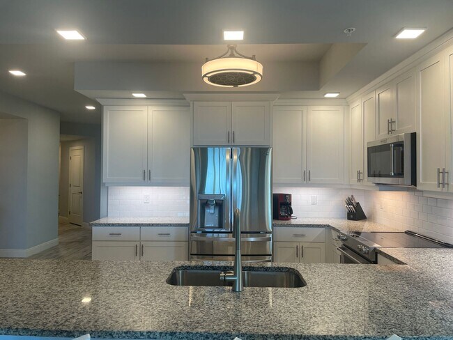 Building Photo - Coastal Luxury at Hidden Bay | 3BR Waterfront Condo with Bay Views