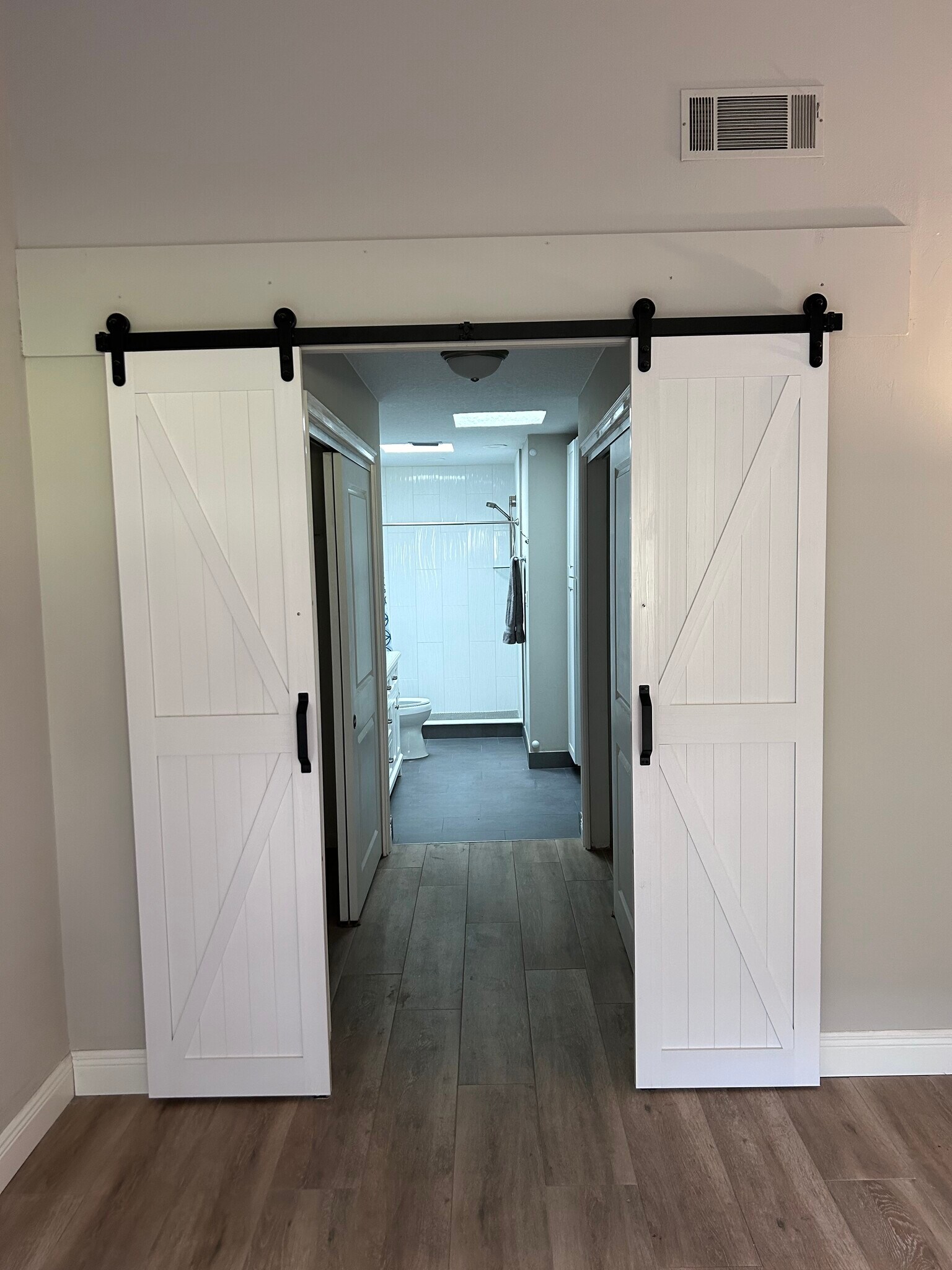 Barndoor style doors to Master Bath - 8559 Pomelo Tree Ln