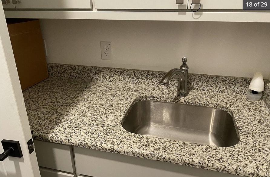 Sink in laundry room and folding counter - 24719 Resort Pky