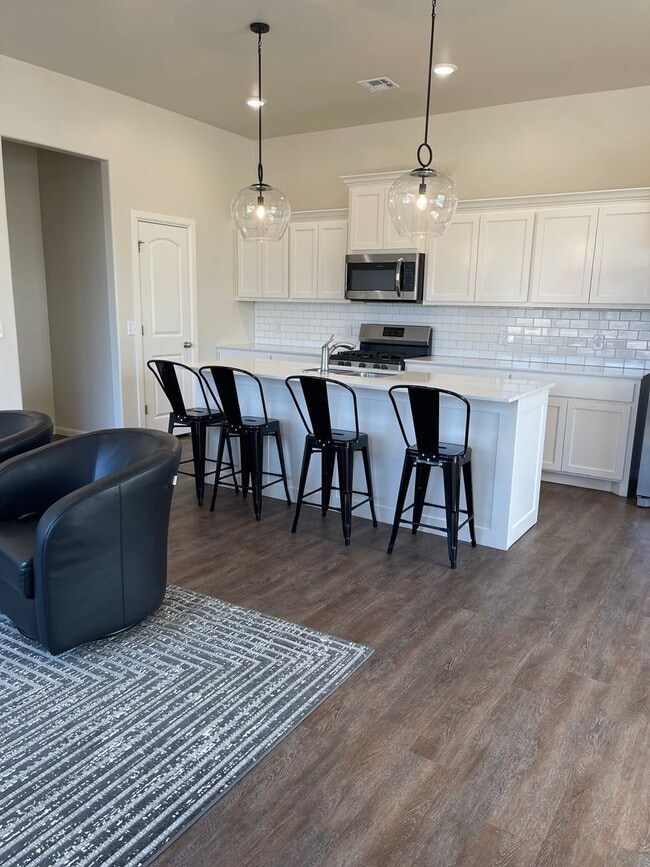Building Photo - *Fully Furnished* 4 bedroom, 2.5 bathroom, 2 car garage Gated Neighborhood