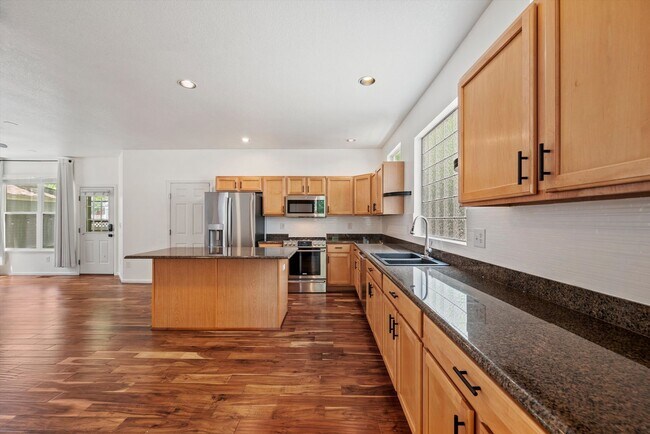 Building Photo - Stunning Tennyson Park Home | 4 Bedrooms, Finished Basement & Open Space Views