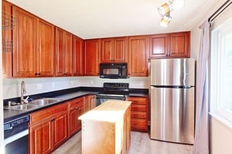 Building Photo - Spacious 3-Bedroom Attached Villa with Finished Basement & Private Fenced Yard!