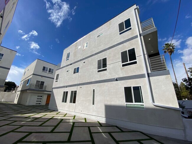 Side View of a Front Unit and Partial View of a Back Unit - 5747 Fulcher Ave