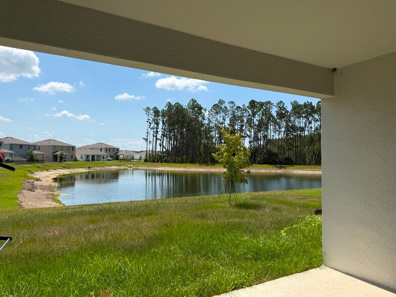 Back yard with pond view - 6856 Daintree Ct