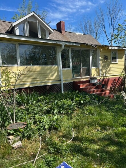 front of house, roof in process - 35 Sprinkle St