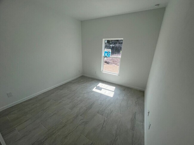 Building Photo - MODERN BRAND NEW RETREAT IN LEHIGH ACRES!