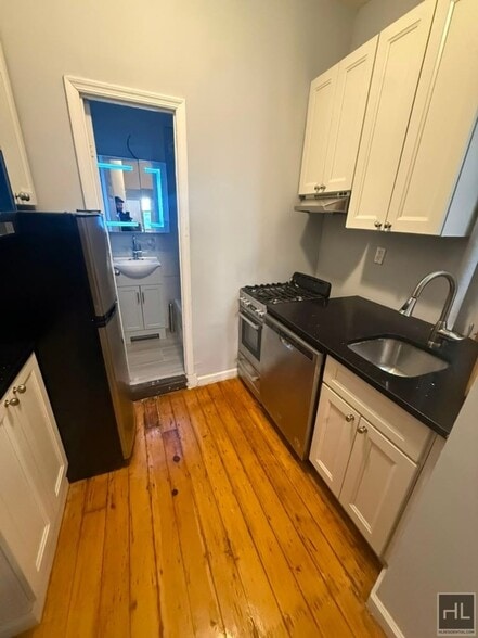 Building Photo - Classic East Village One-Bedroom with Exposed Brick & High Ceilings