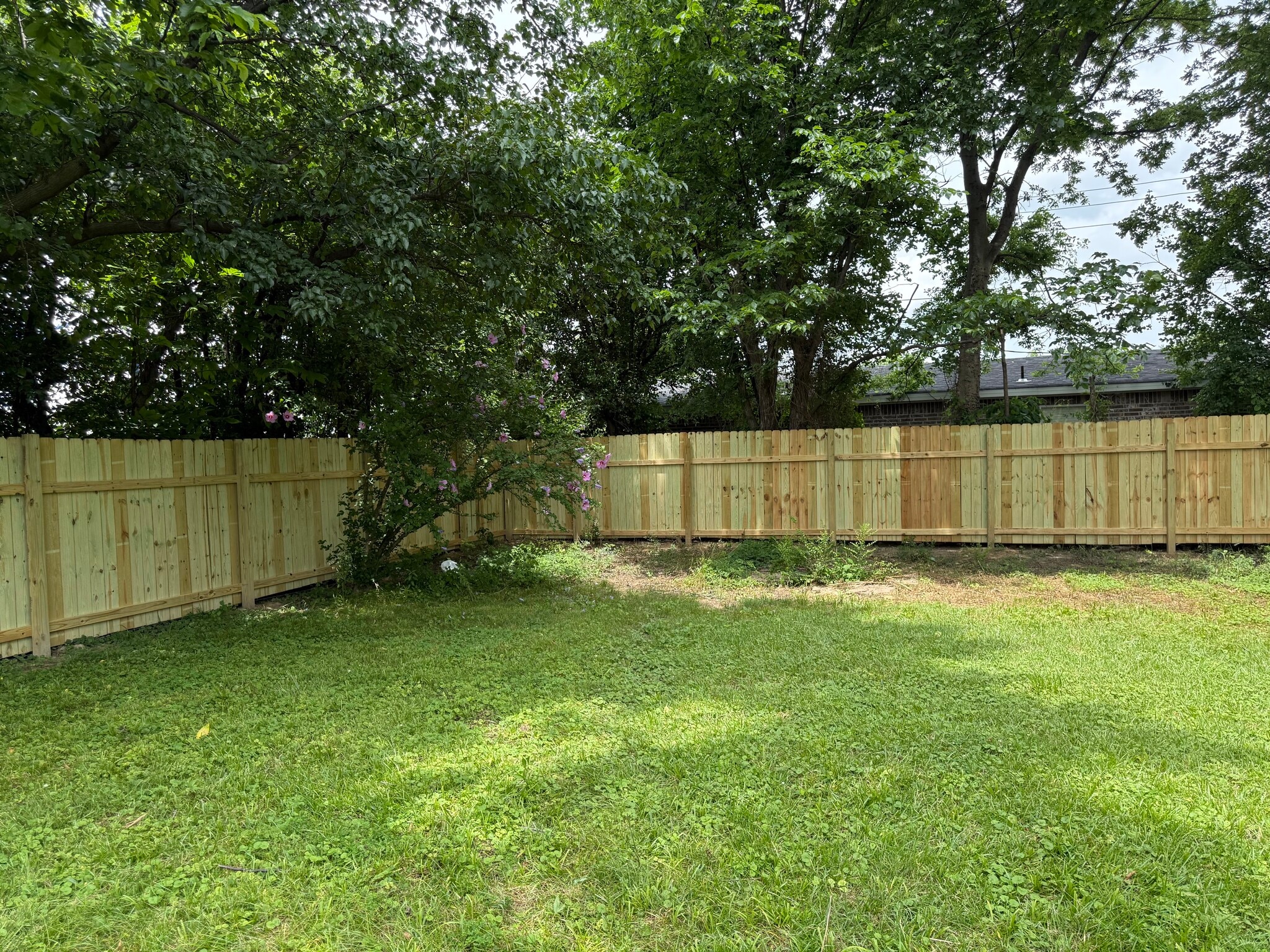 Fenced Back yard. Tidal Wave car wash next door. Quiet apartments to north. - 2410 Forest Home Rd