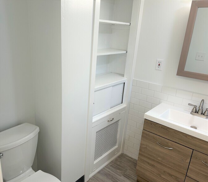 Bathroom with built-in shelves and hideaway hamper - 508 Central Ave
