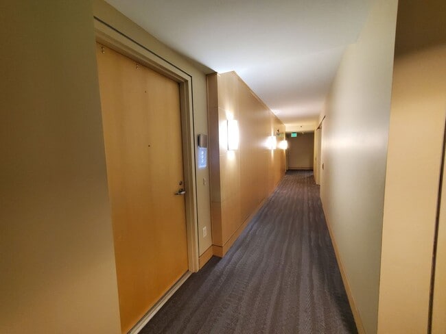 Building Photo - Downtown High-Rise Studio with parking and in-home laundry