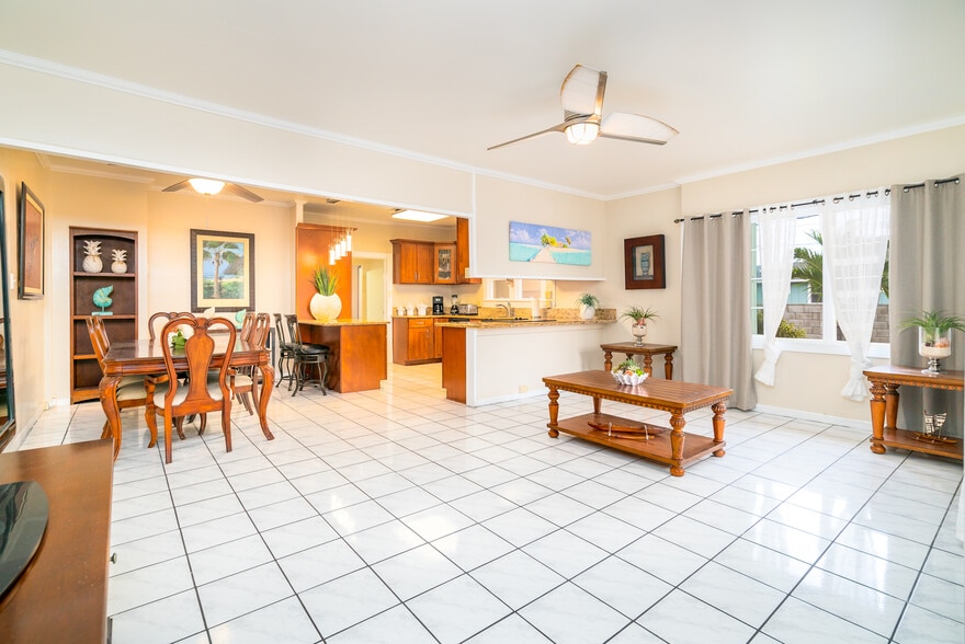 View from open concept living room into kitchen and dining area. - 408 N Kainalu Dr