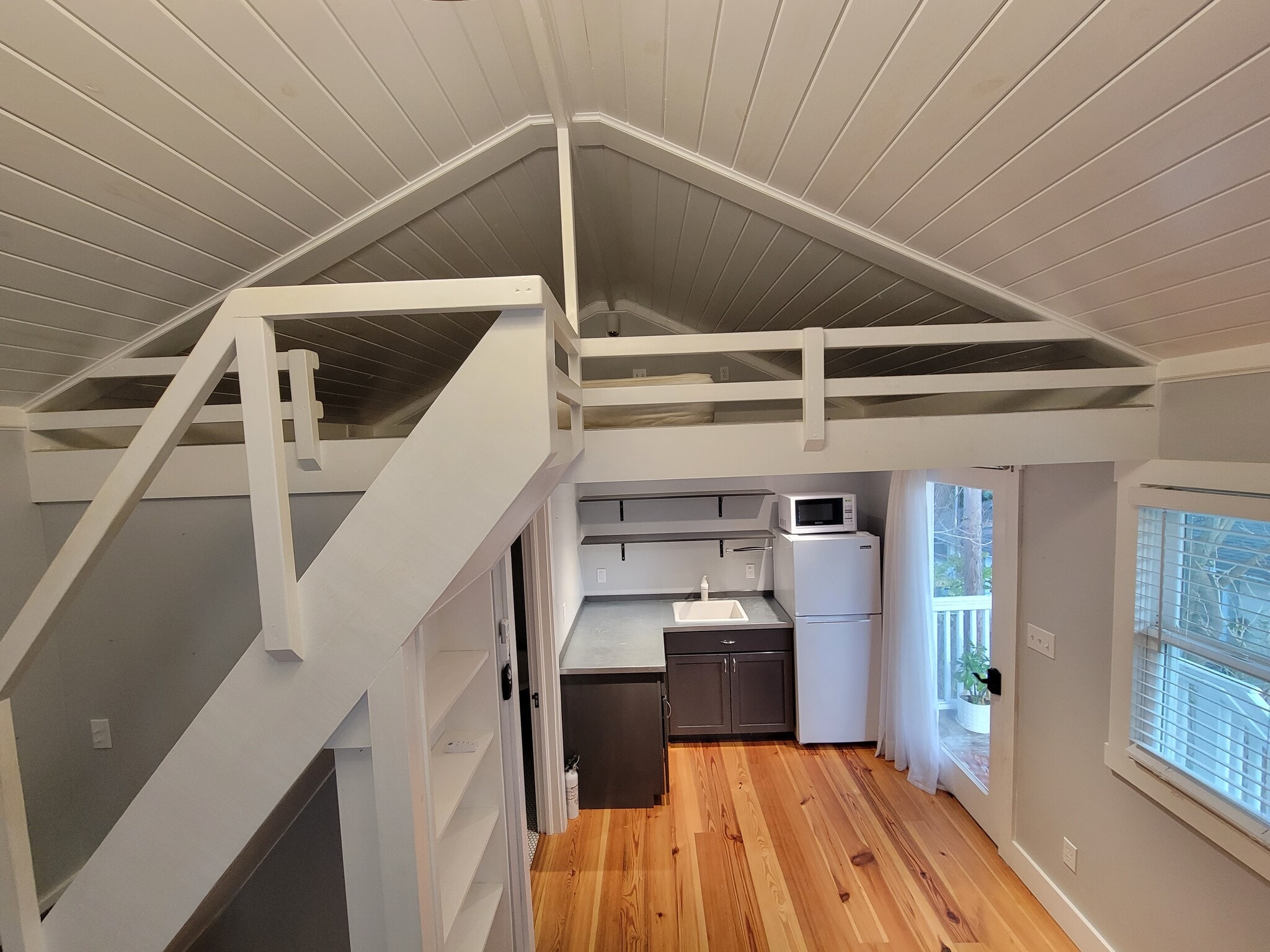Bedroom loft comfortably fits a full or queen mattress. - 701 Bay Ave