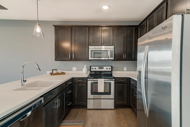 Modern kitchens are designed with sleek finishes and high-end appliances for a polished, functional space. - The Helen