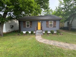 Building Photo - Classic charm meets modern comfort in this updated Madison cottage with a large backyard and conv...