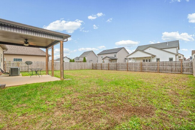 Building Photo - Four Bedroom with Three Car Garage!