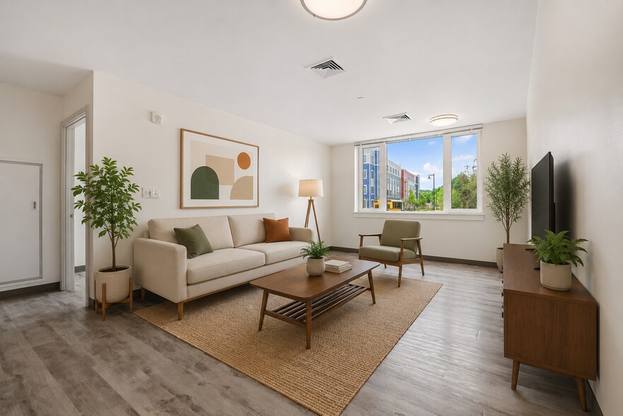 Spacious budget friendlyapartment living area at 40 & 50 Great Brook Valley Ave - The Phoenix at Curtis Apartments