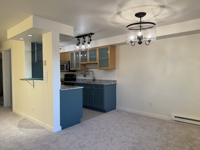 Dining area and kitchen - 701 122nd Ave NE