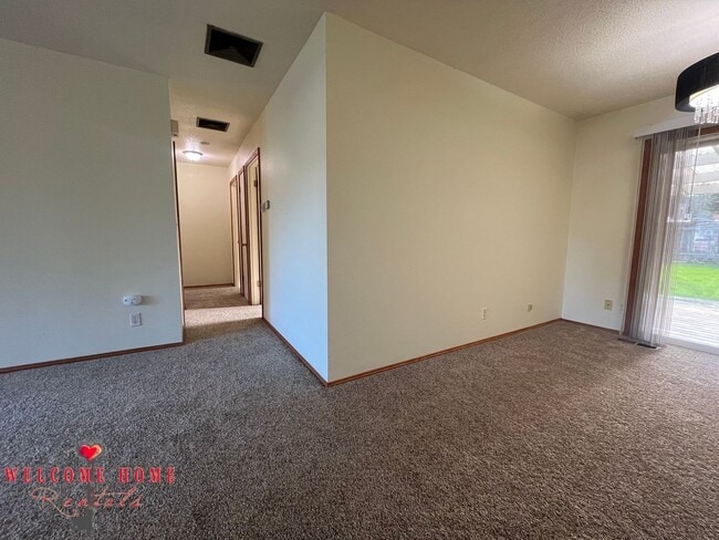 Building Photo - Beautiful Remodeled Rambler!!!  Come enjoy this HUGE backyard!!  NEW CARPET!!