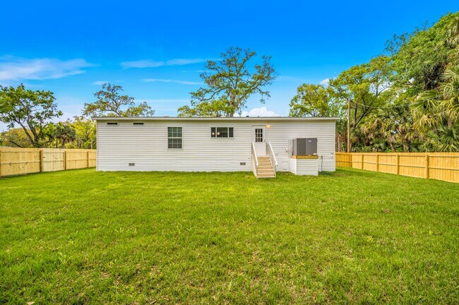 Building Photo - Experience exceptional living at its finest