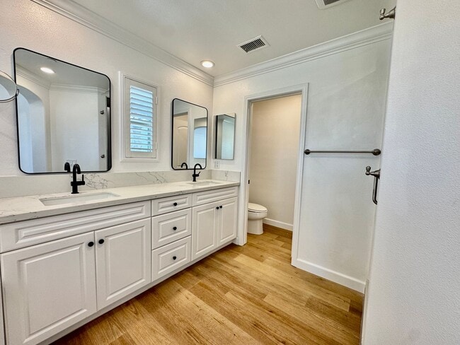 Building Photo - Beautifully Remodel Townhouse with AC & Two Car Garage!
