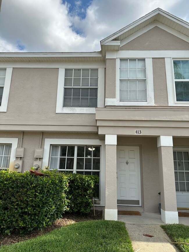 Building Photo - Beautiful Townhome in a gated community with assigned parking spots and a community pool