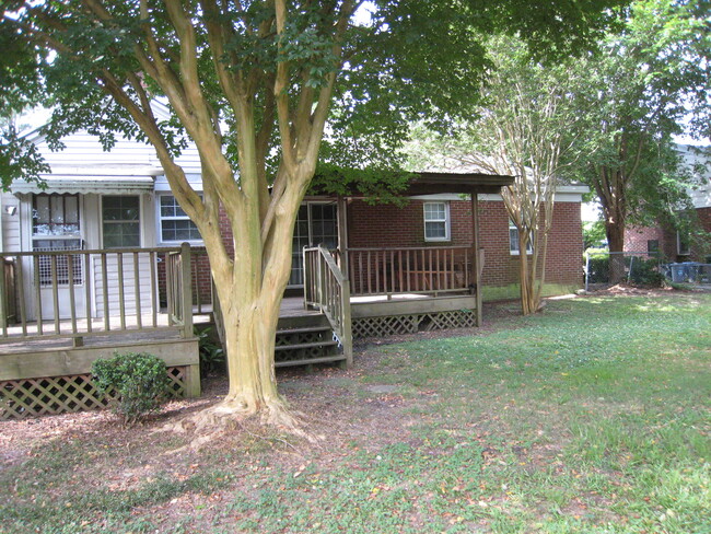 Large fenced backyard. - 1911 E 4th St