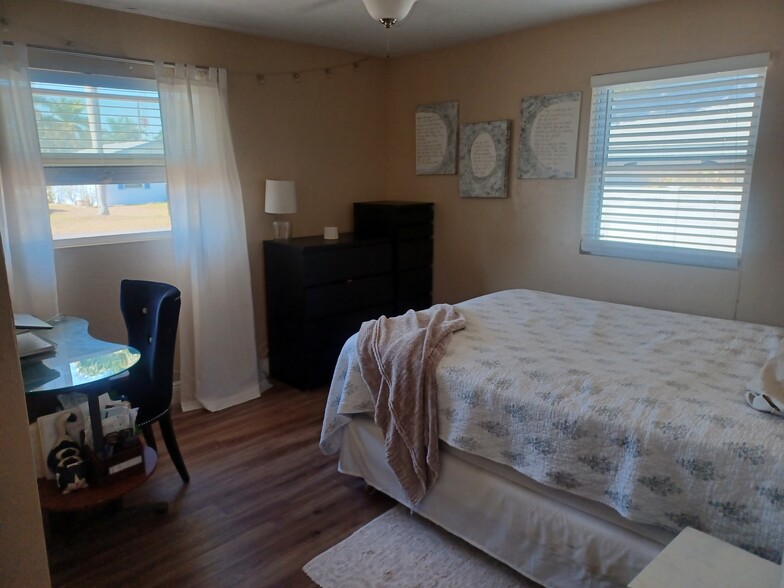 Two large guest bedrooms all with solid vinyl flooring and 2" blinds - 12080 Moss Dr