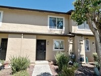 Building Photo - Move-in ready Evergreen townhome with private backyard, detached 2-car garage, and great communit...